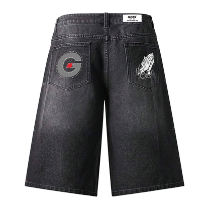 Black denim jorts with embroidered artwork at the back pockets and  Rhinestone detailing on the front 